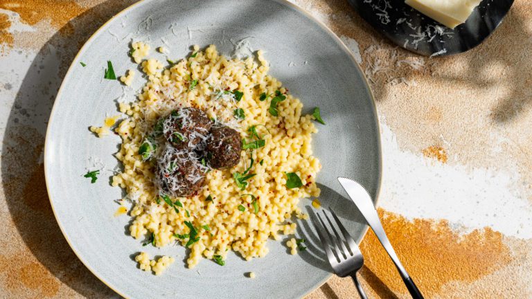 Cheese pearl couscous with kafta and chili butter